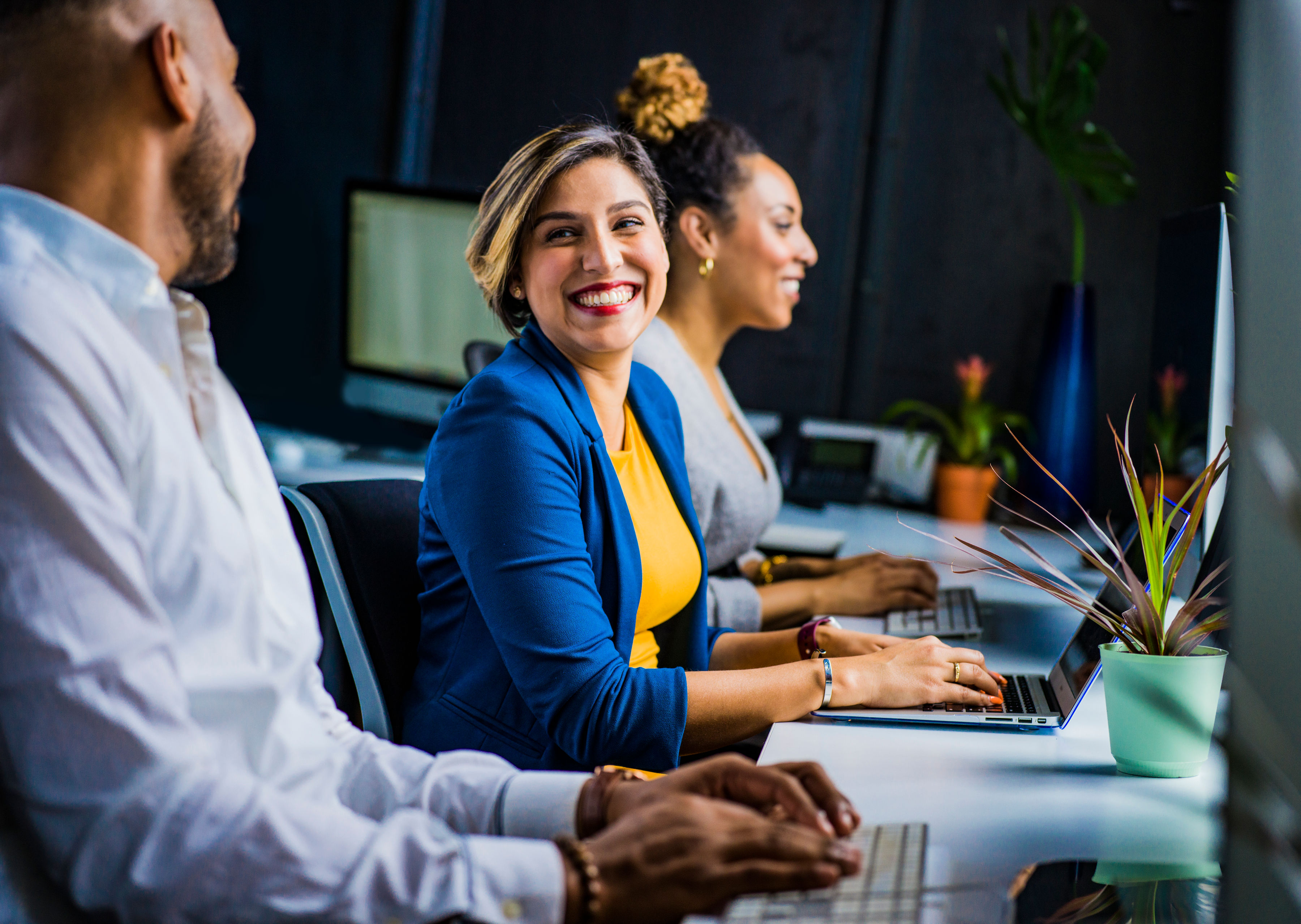 Smiling sales team member in a meeting